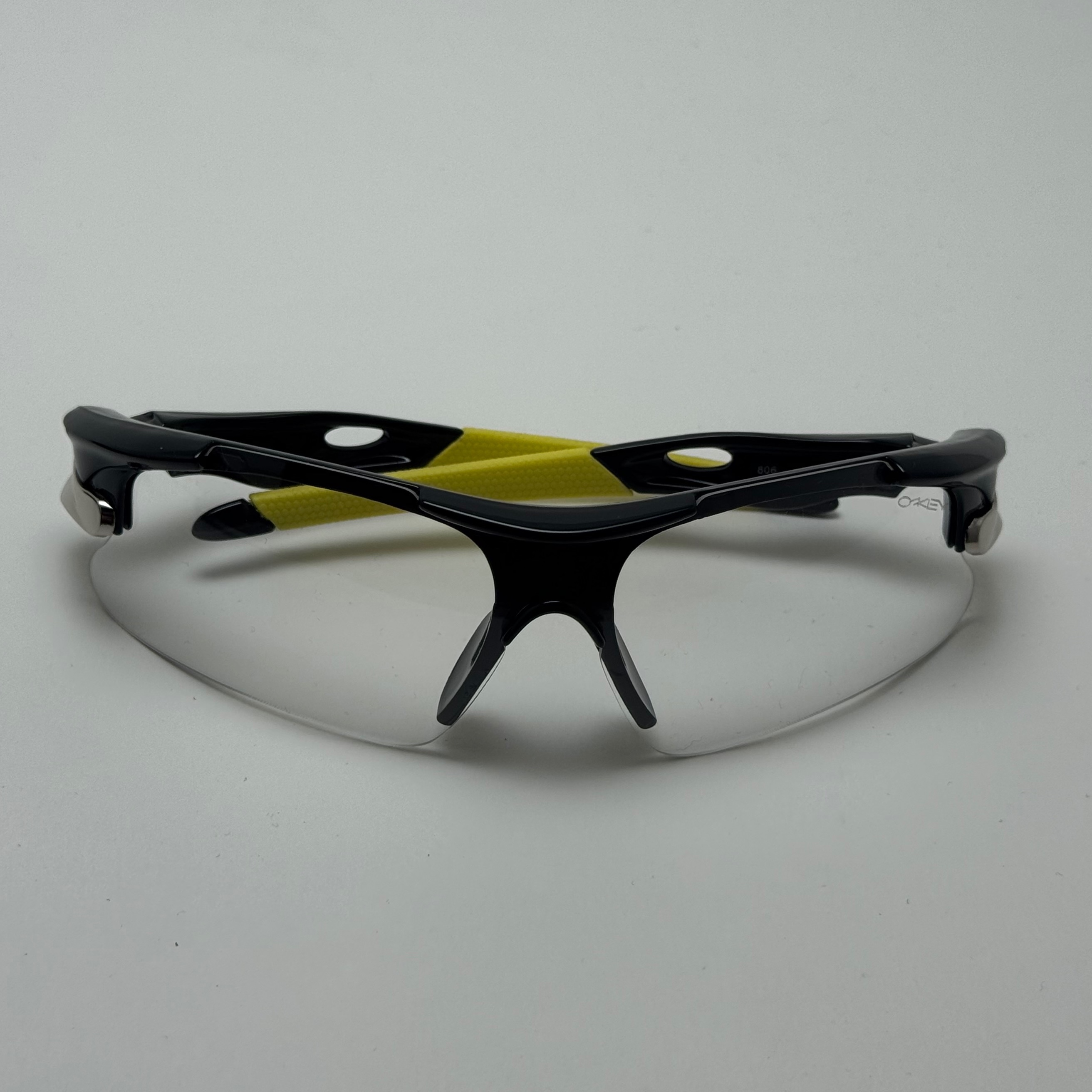 عینک شب اسپرت اوکلی Oakley مدلRadar عدسی بی رنگ فریم مشکی کد 806 - عینک طوفان - عینک شب