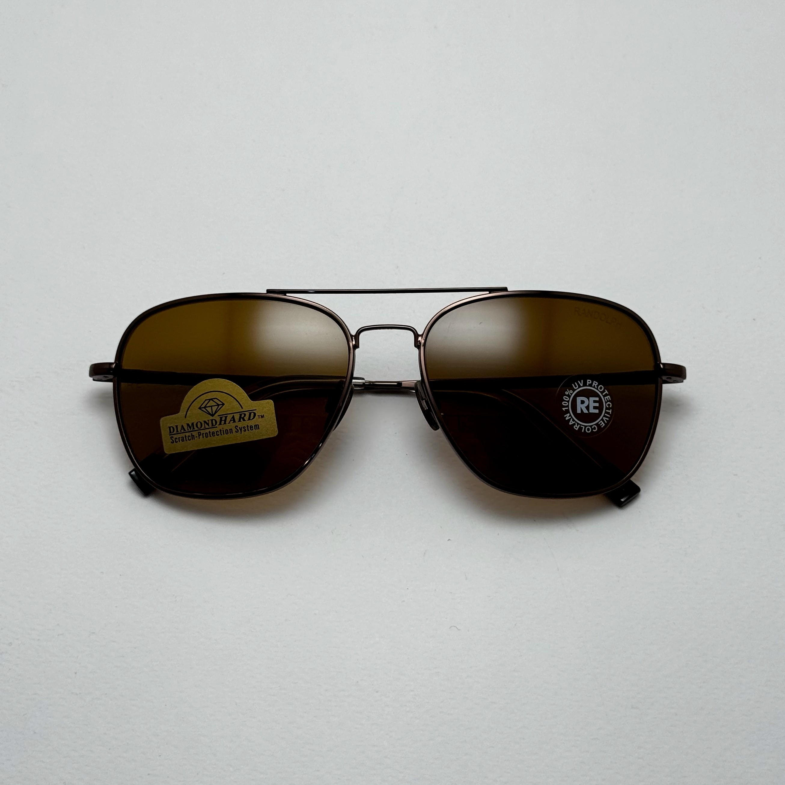 عینک آفتابی خلبانی رندولف شیشه سنگ آنتی رفلکس قهوه ای فریم قهوه ای فول پک RANDOLPH AVIATOR RE 58 24K