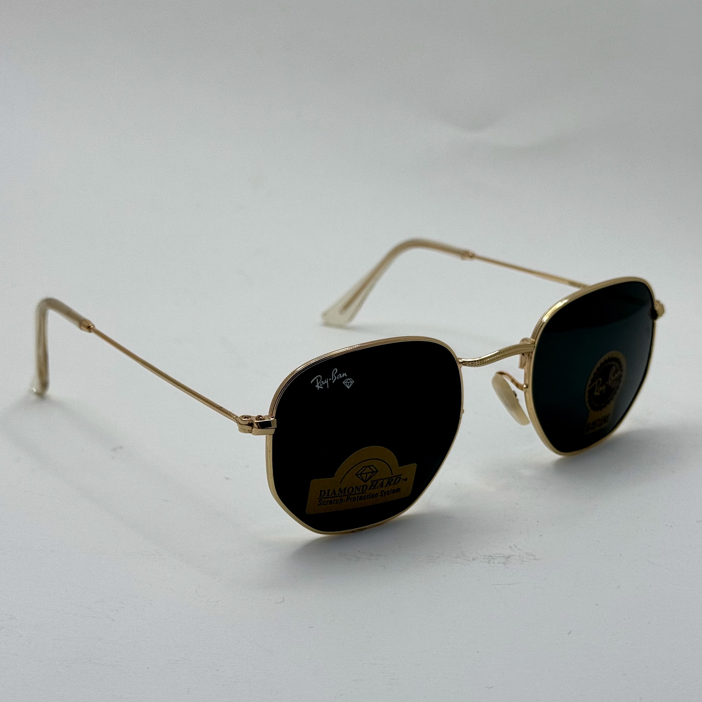 عینک ریبن هگزونال شیشه سنگ مشکی فریم طلایی به همراه پک کامل ریبن کد Rayban RB 3548