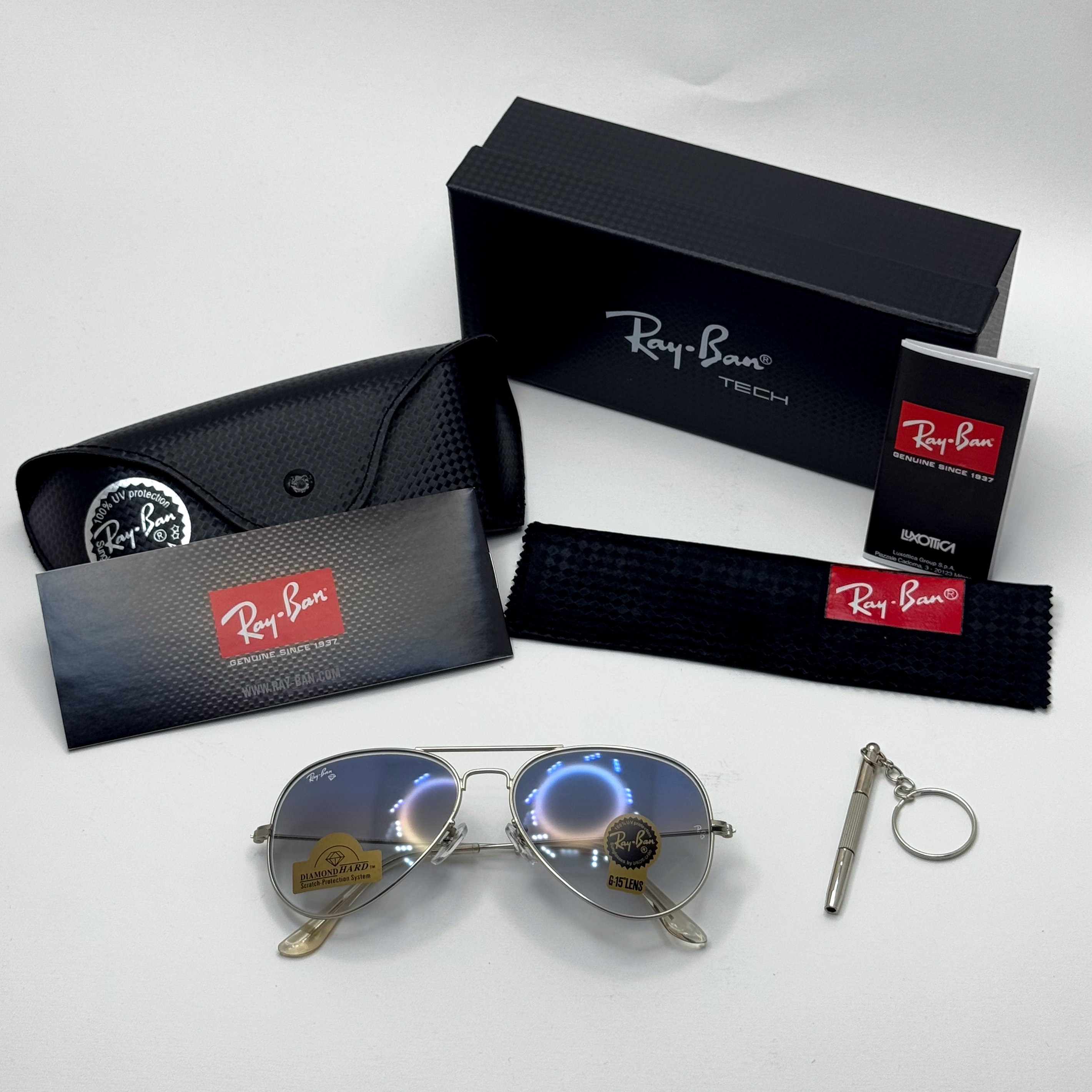 عینک ریبن خلبانی شیشه سنگ آبی هایلایت فریم نقره ای به همراه پک کامل ریبن کد Rayban RB 3025
