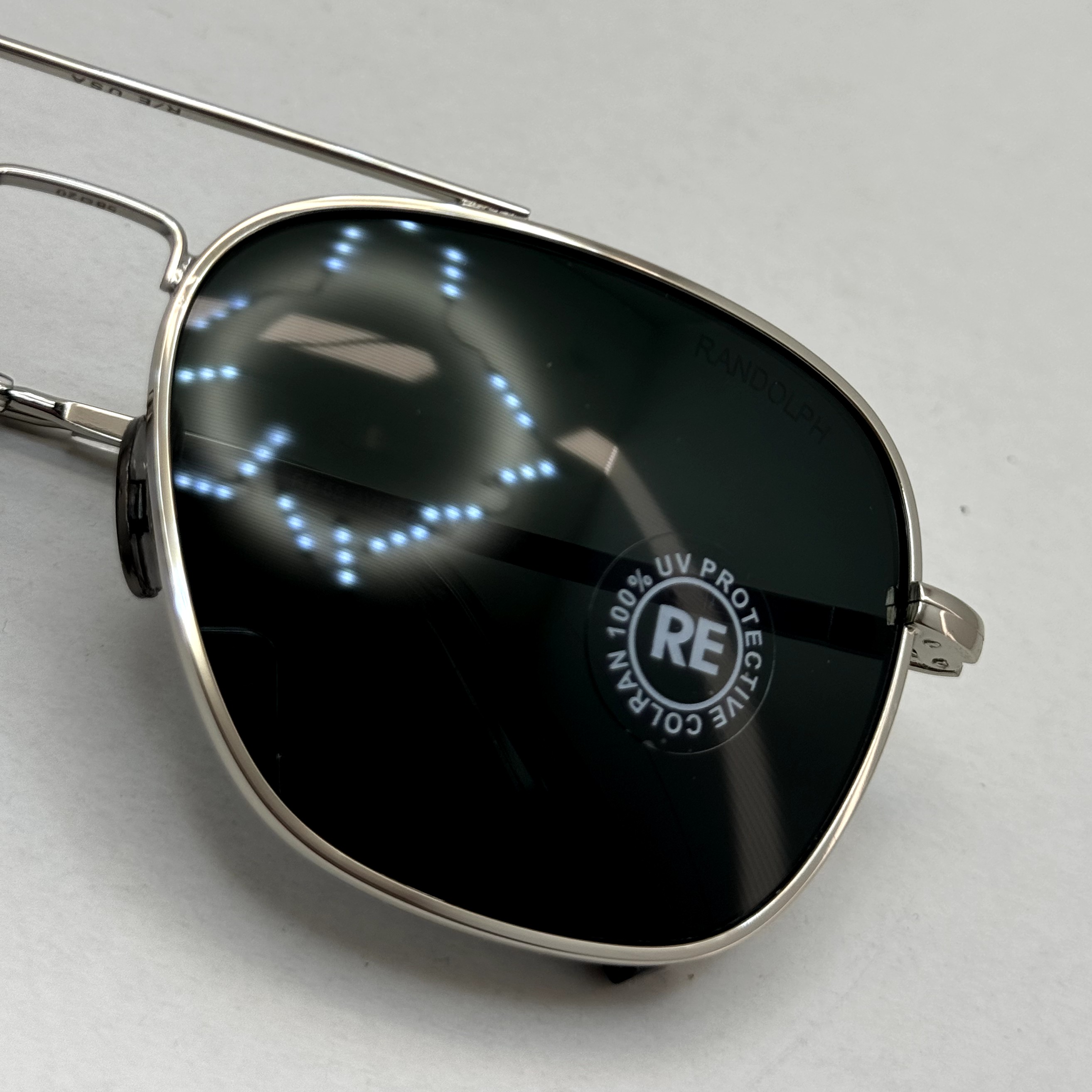 عینک آفتابی خلبانی رندولف شیشه سنگ آنتی رفلکس مشکی فریم نقره ای فول پک RANDOLPH AVIATOR RE 58 WHITE GOLD