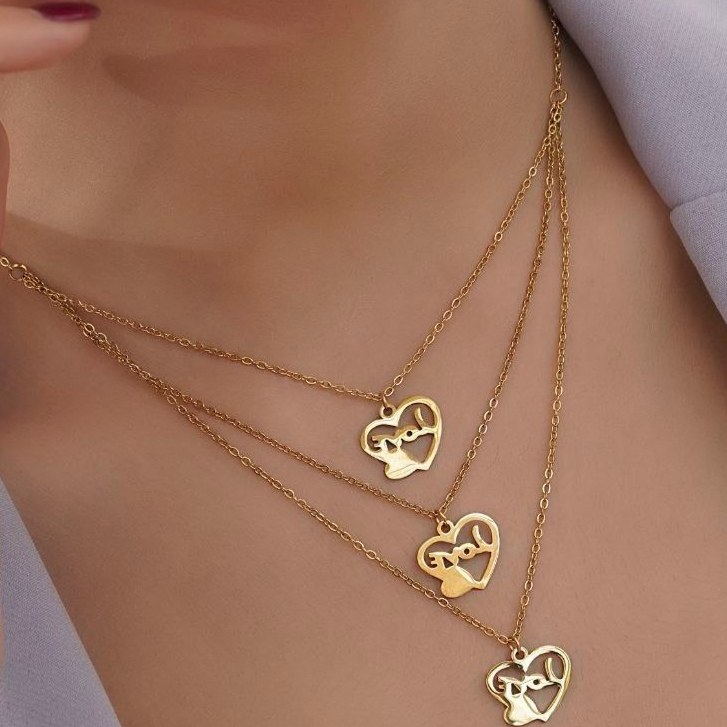 نیم ست گوشواره و گردنبند استیل آویز چند لاین طرح قلب love طلایی رنگ ثابت mp