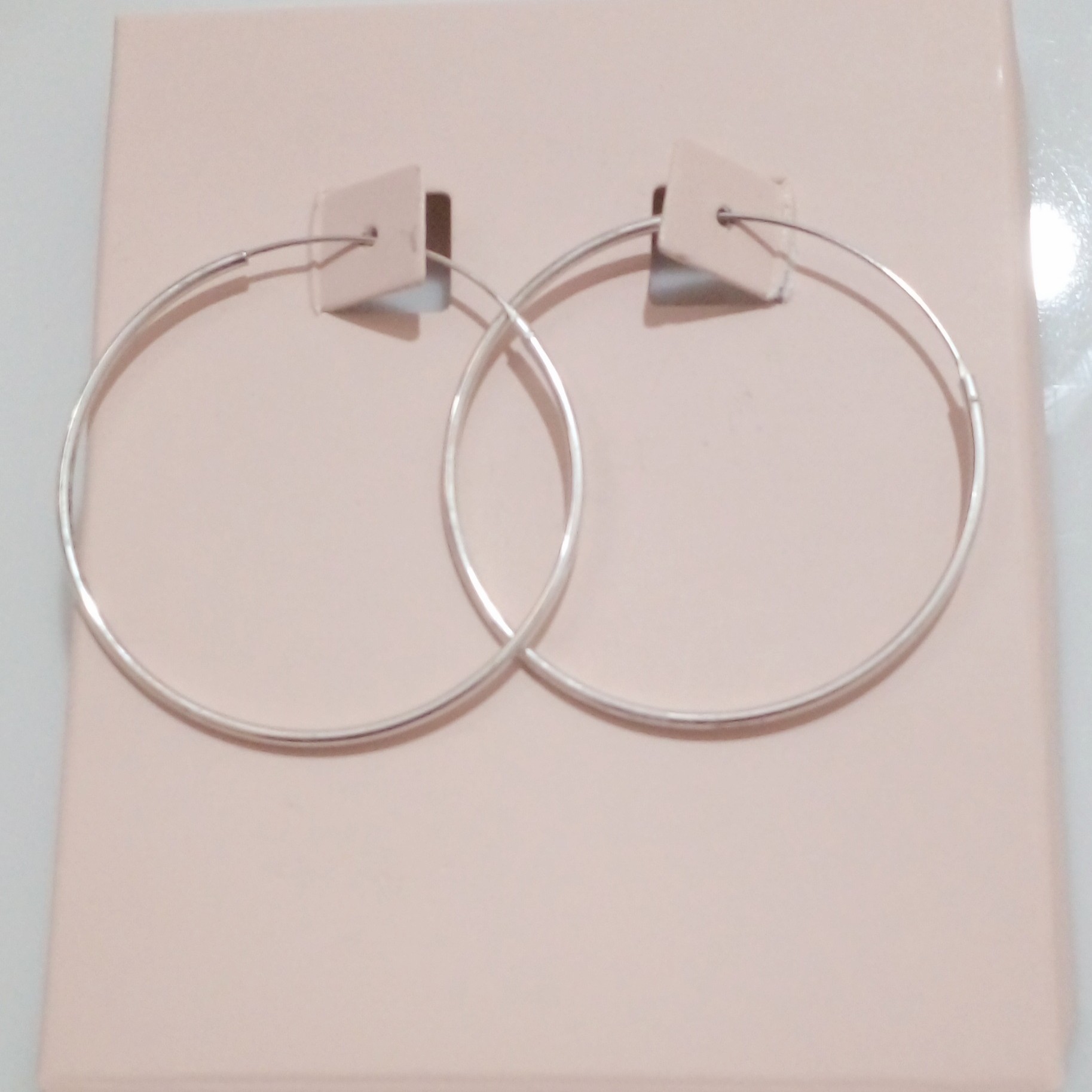 گوشواره حلقه ایی نقره با حک عیار 925 از برند sterling silver