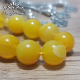 تسبیح عقیق زرد اصل درشت با شرابه فلزی