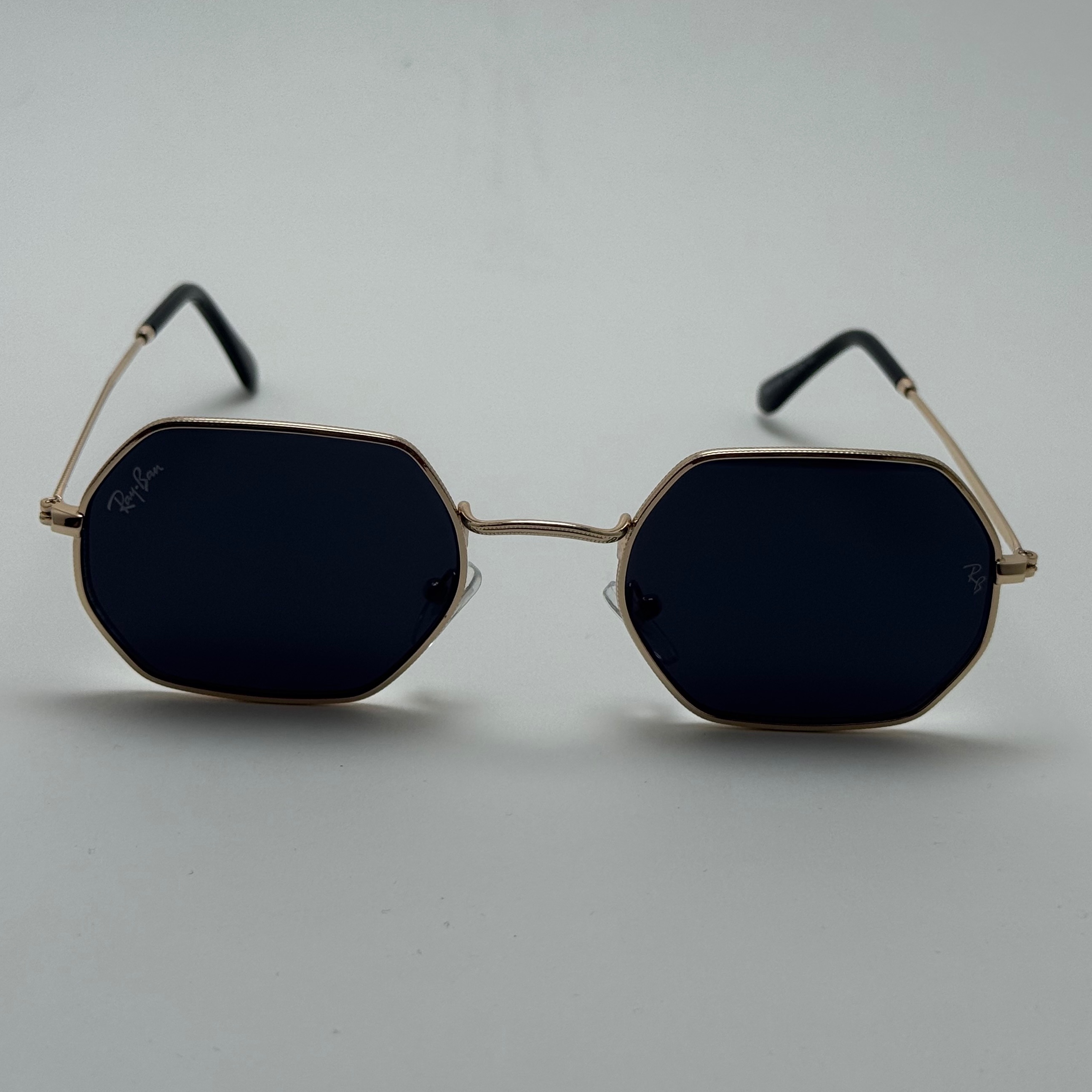 عینک آفتابی ریبن Ray-ban شش ضلعی مشکی طلایی سبک کد RB 3556